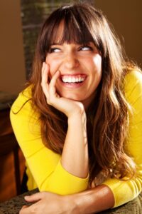 Type I Personality - Cheerful looking woman laughing